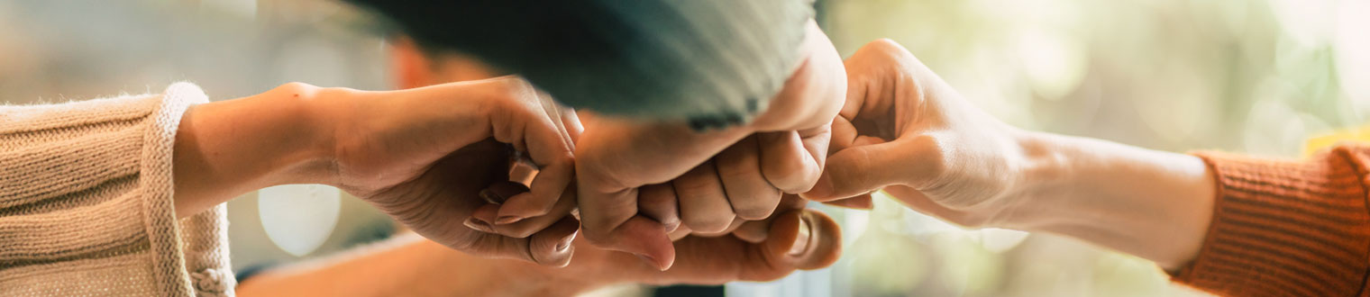 People fist bumping